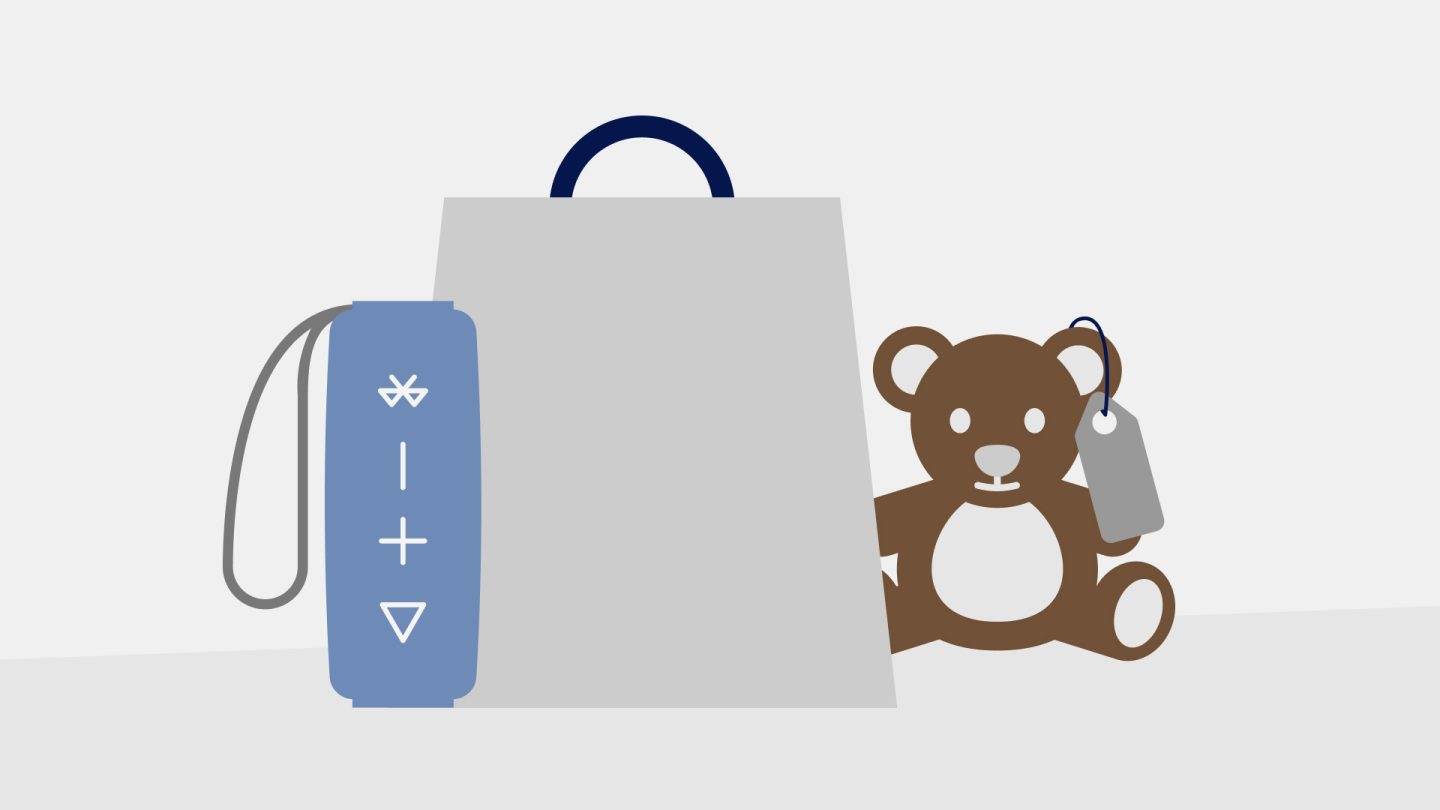 Teddy bear and shopping bag, illustrating items bought in the Duty Free section.